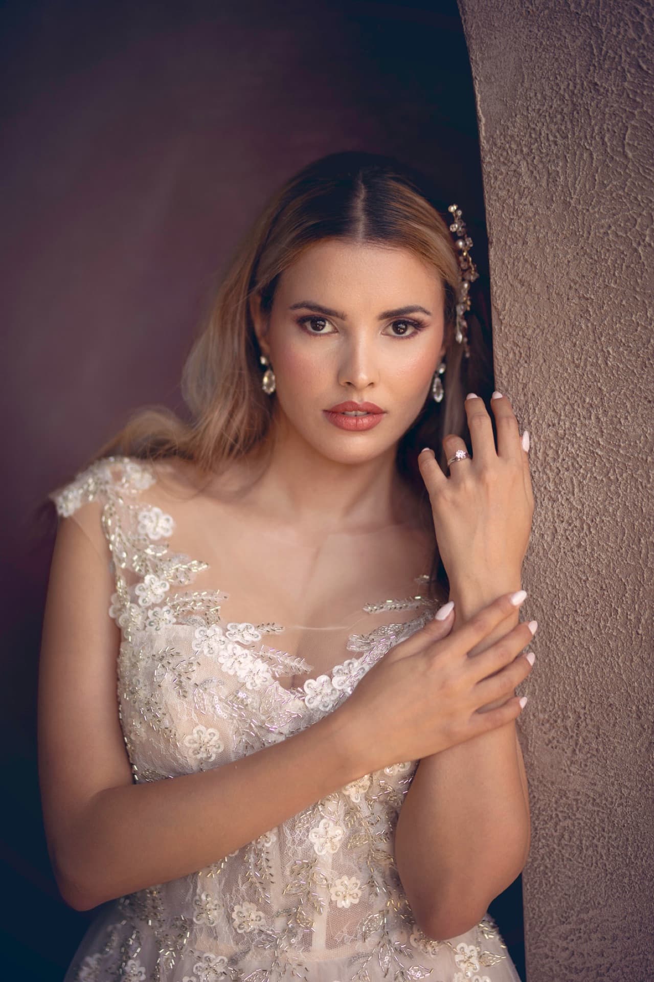 Elegant bridal look with floral hair accessories and embroidered gown
